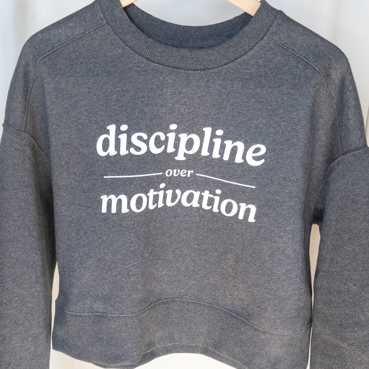 Discipline Over Motivation Cropped Crewneck